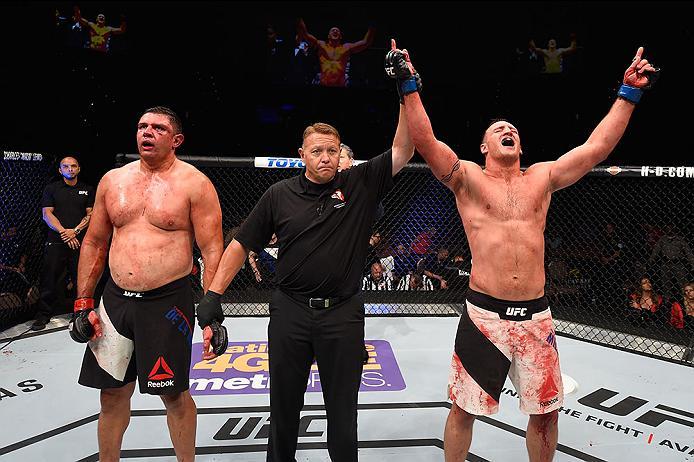 LAS VEGAS, NV - MAY 29: Adam Milstead (right) reacts to his victory over Chris De La Rocha (left) in their heavyweight bout during the UFC Fight Night event inside the Mandalay Bay Events Center on May 29, 2016 in Las Vegas, Nevada.  (Photo by Josh Hedges