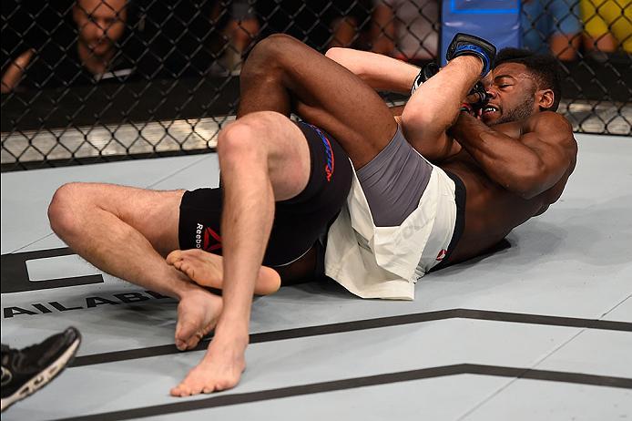 LAS VEGAS, NV - MAY 29: Aljamain Sterling (white trunks) attempts to submit Bryan Caraway in their bantamweight bout during the UFC Fight Night event inside the Mandalay Bay Events Center on May 29, 2016 in Las Vegas, Nevada.  (Photo by Josh Hedges/Zuffa 