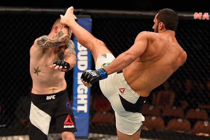 LAS VEGAS, NV - MAY 29: (R-L) Alberto Uda of Brazil kicks Jake Collier in their middleweight bout during the UFC Fight Night event inside the Mandalay Bay Events Center on May 29, 2016 in Las Vegas, Nevada.  (Photo by Josh Hedges/Zuffa LLC/Zuffa LLC via G