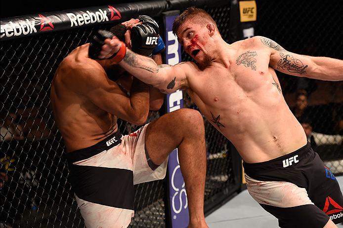 LAS VEGAS, NV - MAY 29: (R-L) Jake Collier elbows Alberto Uda of Brazil in their middleweight bout during the UFC Fight Night event inside the Mandalay Bay Events Center on May 29, 2016 in Las Vegas, Nevada.  (Photo by Josh Hedges/Zuffa LLC/Zuffa LLC via 