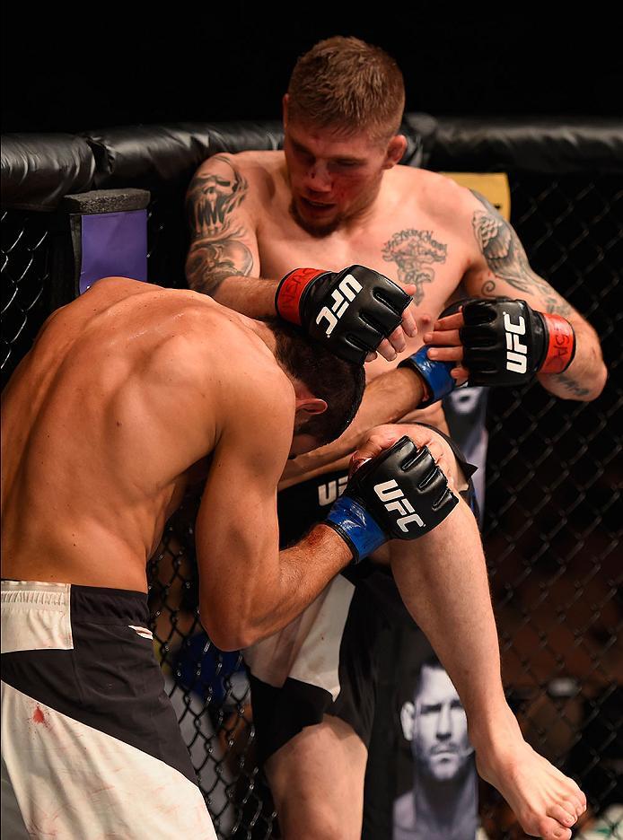 LAS VEGAS, NV - MAY 29: Jake Collier (top) knees Alberto Uda of Brazil in their middleweight bout during the UFC Fight Night event inside the Mandalay Bay Events Center on May 29, 2016 in Las Vegas, Nevada.  (Photo by Josh Hedges/Zuffa LLC/Zuffa LLC via G