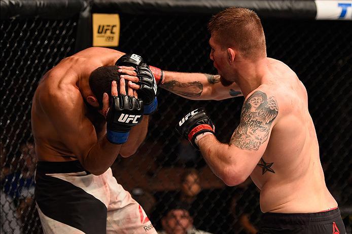 LAS VEGAS, NV - MAY 29: (R-L) Jake Collier punches Alberto Uda of Brazil in their middleweight bout during the UFC Fight Night event inside the Mandalay Bay Events Center on May 29, 2016 in Las Vegas, Nevada. (Photo by Josh Hedges/Zuffa LLC/Zuffa LLC via