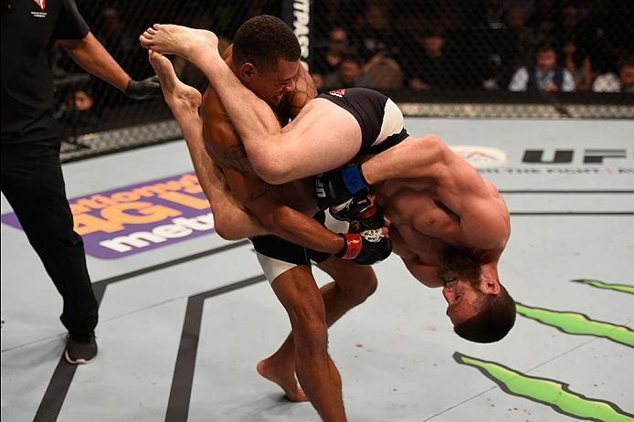 LAS VEGAS, NV - MAY 29: Jordan Rinaldi (black trunks) attempts to submit Abel Trujillo in their lightweight bout during the UFC Fight Night event inside the Mandalay Bay Events Center on May 29, 2016 in Las Vegas, Nevada. (Photo by Josh Hedges/Zuffa LLC/