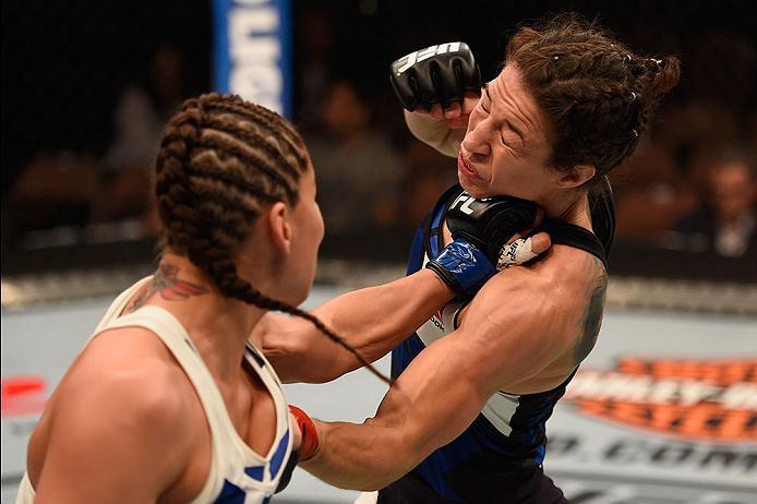 LAS VEGAS, NV - MAY 29: (L-R) Jessica Eye punches Sara McMann in their women's bantamweight bout during the UFC Fight Night event inside the Mandalay Bay Events Center on May 29, 2016 in Las Vegas, Nevada.  (Photo by Josh Hedges/Zuffa LLC/Zuffa LLC via Ge