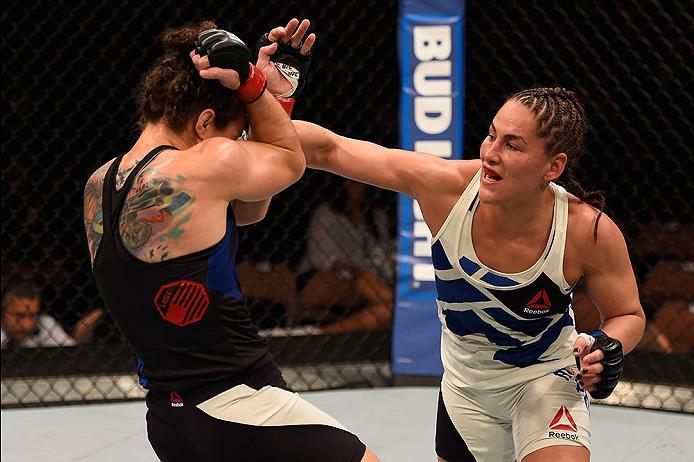 LAS VEGAS, NV - MAY 29:  (R-L) Jessica Eye punches Sara McMann in their women's bantamweight bout during the UFC Fight Night event inside the Mandalay Bay Events Center on May 29, 2016 in Las Vegas, Nevada.  (Photo by Josh Hedges/Zuffa LLC/Zuffa LLC via G