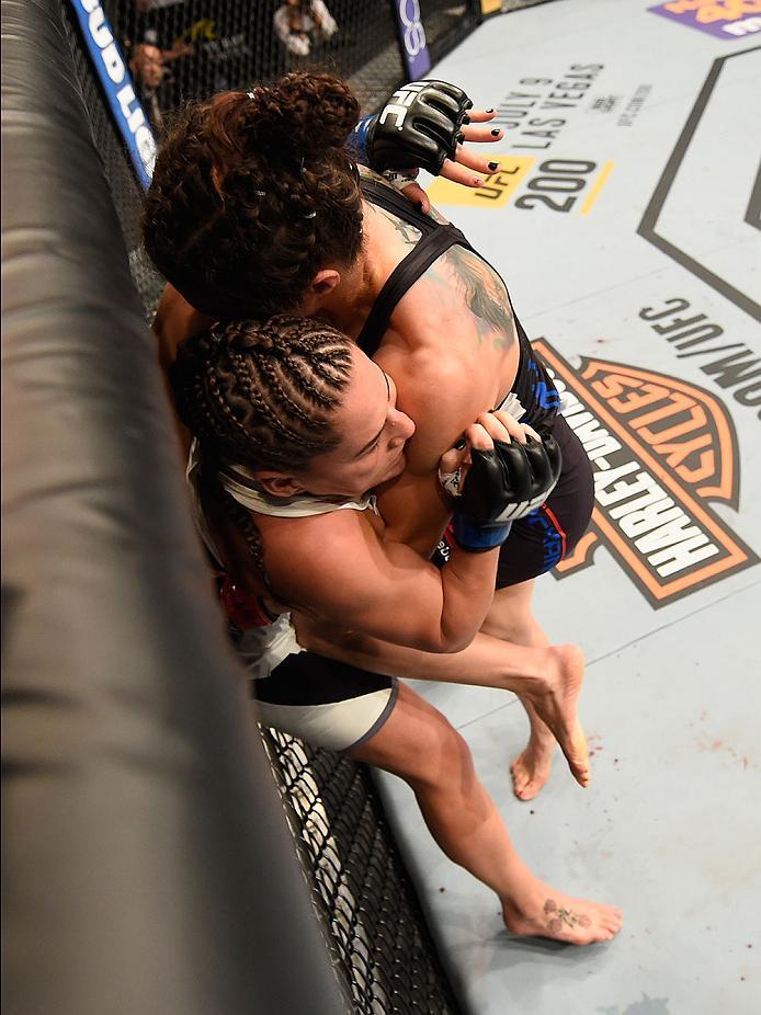 LAS VEGAS, NV - MAY 29: Sara McMann (black) knees Jessica Eye in their women's bantamweight bout during the UFC Fight Night event inside the Mandalay Bay Events Center on May 29, 2016 in Las Vegas, Nevada. (Photo by Josh Hedges/Zuffa LLC/Zuffa LLC via Ge