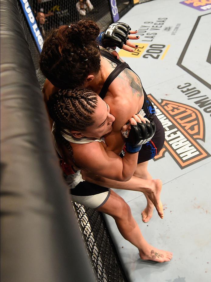 LAS VEGAS, NV - MAY 29: Sara McMann (black) knees Jessica Eye in their women's bantamweight bout during the UFC Fight Night event inside the Mandalay Bay Events Center on May 29, 2016 in Las Vegas, Nevada.  (Photo by Josh Hedges/Zuffa LLC/Zuffa LLC via Ge