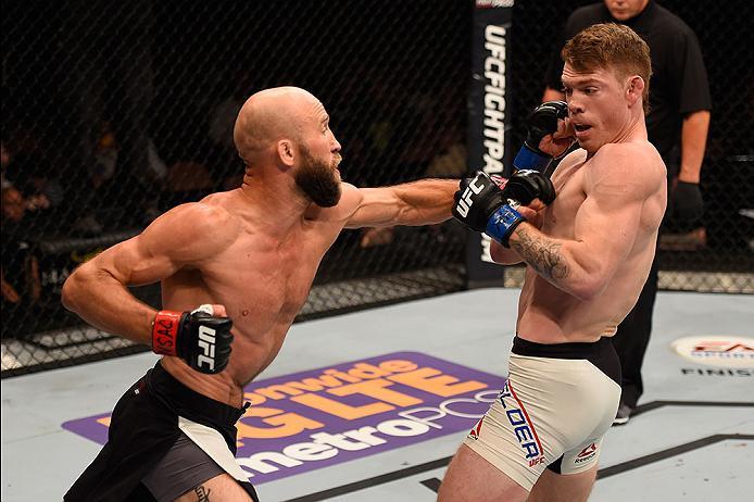 LAS VEGAS, NV - MAY 29: (L-R) Joshua Burkman punches Paul Felder in their lightweight bout during the UFC Fight Night event inside the Mandalay Bay Events Center on May 29, 2016 in Las Vegas, Nevada.  (Photo by Josh Hedges/Zuffa LLC/Zuffa LLC via Getty Im