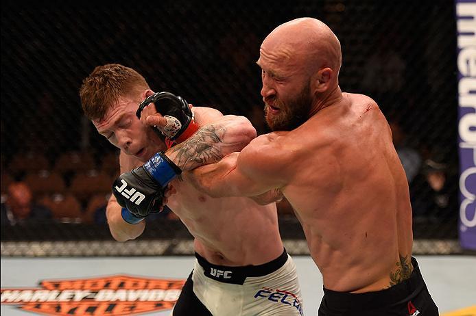 LAS VEGAS, NV - MAY 29: (L-R) Paul Felder punches Joshua Burkman in their lightweight bout during the UFC Fight Night event inside the Mandalay Bay Events Center on May 29, 2016 in Las Vegas, Nevada.  (Photo by Josh Hedges/Zuffa LLC/Zuffa LLC via Getty Im