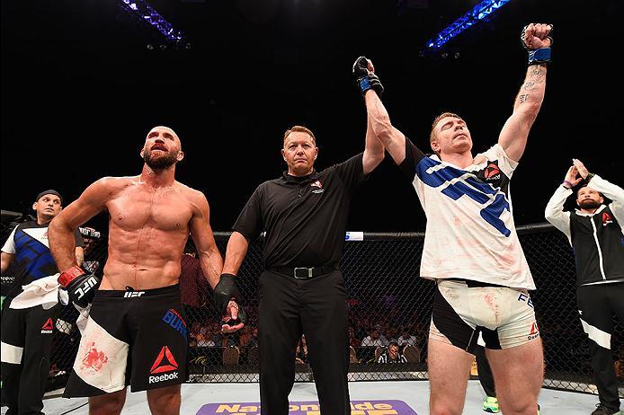 LAS VEGAS, NV - MAY 29: Paul Felder (right) reacts to his victory over Joshua Burkman (left) in their lightweight bout during the UFC Fight Night event inside the Mandalay Bay Events Center on May 29, 2016 in Las Vegas, Nevada.  (Photo by Josh Hedges/Zuff