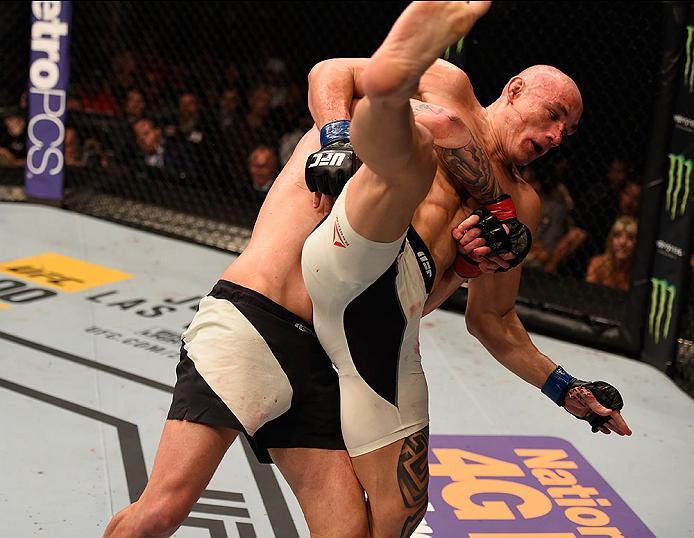 LAS VEGAS, NV - MAY 29: Chris Camozzi (black trunks) slams Vitor Miranda of Brazil in their middleweight bout during the UFC Fight Night event inside the Mandalay Bay Events Center on May 29, 2016 in Las Vegas, Nevada.  (Photo by Josh Hedges/Zuffa LLC/Zuf