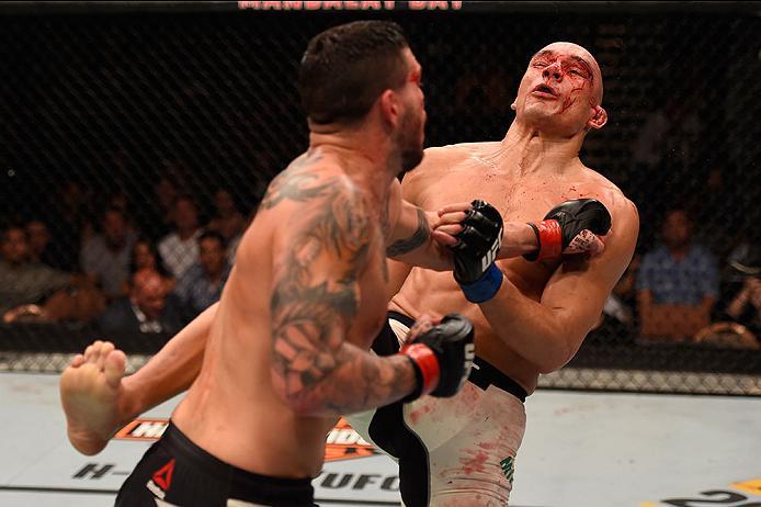 LAS VEGAS, NV - MAY 29: (L-R) Chris Camozzi punches Vitor Miranda of Brazil in their middleweight bout during the UFC Fight Night event inside the Mandalay Bay Events Center on May 29, 2016 in Las Vegas, Nevada. (Photo by Josh Hedges/Zuffa LLC/Zuffa LLC
