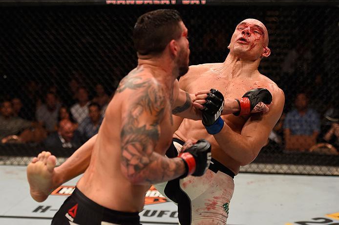 LAS VEGAS, NV - MAY 29: (L-R) Chris Camozzi punches Vitor Miranda of Brazil in their middleweight bout during the UFC Fight Night event inside the Mandalay Bay Events Center on May 29, 2016 in Las Vegas, Nevada.  (Photo by Josh Hedges/Zuffa LLC/Zuffa LLC 