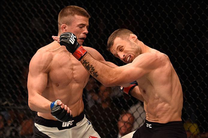 LAS VEGAS, NV - MAY 29: (L-R) Rick Story punches Tarec Saffiedine of Belgium in their welterweight bout during the UFC Fight Night event inside the Mandalay Bay Events Center on May 29, 2016 in Las Vegas, Nevada.  (Photo by Josh Hedges/Zuffa LLC/Zuffa LLC