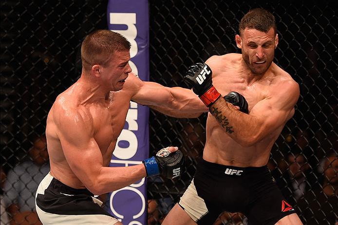 LAS VEGAS, NV - MAY 29: (L-R) Rick Story punches Tarec Saffiedine of Belgium in their welterweight bout during the UFC Fight Night event inside the Mandalay Bay Events Center on May 29, 2016 in Las Vegas, Nevada. (Photo by Josh Hedges/Zuffa LLC/Zuffa LLC