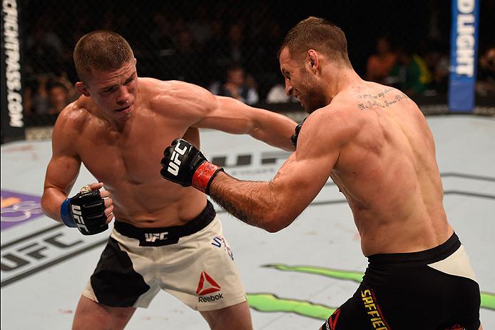 LAS VEGAS, NV - MAY 29: (L-R) Rick Story punches Tarec Saffiedine of Belgium in their welterweight bout during the UFC Fight Night event inside the Mandalay Bay Events Center on May 29, 2016 in Las Vegas, Nevada. (Photo by Josh Hedges/Zuffa LLC/Zuffa LLC