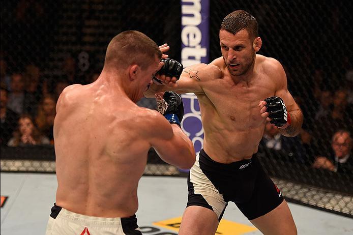 LAS VEGAS, NV - MAY 29: (R-L) Tarec Saffiedine of Belgium punches Rick Story in their welterweight bout during the UFC Fight Night event inside the Mandalay Bay Events Center on May 29, 2016 in Las Vegas, Nevada.  (Photo by Josh Hedges/Zuffa LLC/Zuffa LLC