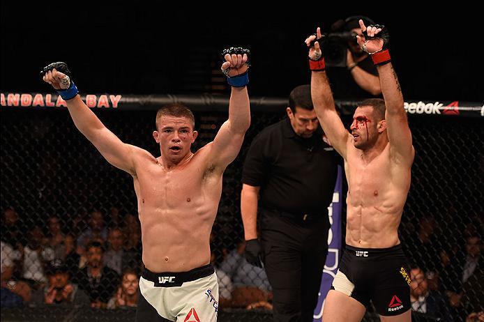 LAS VEGAS, NV - MAY 29: (L-R) Rick Story and Tarec Saffiedine of Belgium raise their hands after their welterweight bout during the UFC Fight Night event inside the Mandalay Bay Events Center on May 29, 2016 in Las Vegas, Nevada.  (Photo by Josh Hedges/Zu