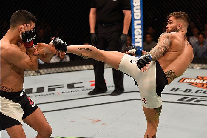 LAS VEGAS, NV - MAY 29: (R-L) Cody Garbrandt kicks Thomas Almeida of Brazil in their bantamweight bout during the UFC Fight Night event inside the Mandalay Bay Events Center on May 29, 2016 in Las Vegas, Nevada.  (Photo by Josh Hedges/Zuffa LLC/Zuffa LLC 