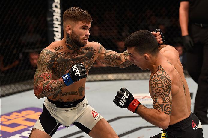 LAS VEGAS, NV - MAY 29:  (L-R) Cody Garbrandt punches Thomas Almeida of Brazil in their bantamweight bout during the UFC Fight Night event inside the Mandalay Bay Events Center on May 29, 2016 in Las Vegas, Nevada.  (Photo by Josh Hedges/Zuffa LLC/Zuffa L