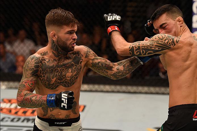 LAS VEGAS, NV - MAY 29:  (L-R) Cody Garbrandt punches Thomas Almeida of Brazil in their bantamweight bout during the UFC Fight Night event inside the Mandalay Bay Events Center on May 29, 2016 in Las Vegas, Nevada.  (Photo by Josh Hedges/Zuffa LLC/Zuffa L