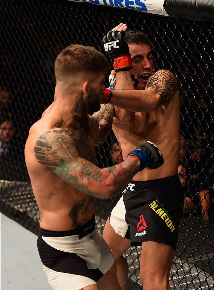 LAS VEGAS, NV - MAY 29: (L-R) Cody Garbrandt punches Thomas Almeida of Brazil in their bantamweight bout during the UFC Fight Night event inside the Mandalay Bay Events Center on May 29, 2016 in Las Vegas, Nevada.  (Photo by Josh Hedges/Zuffa LLC/Zuffa LL