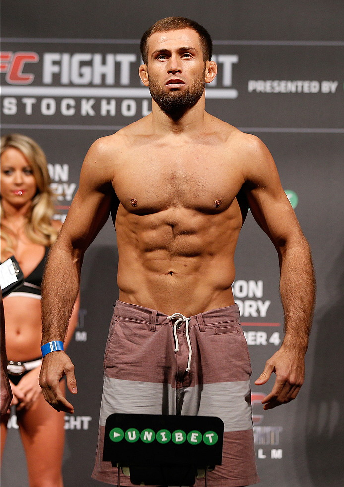 STOCKHOLM, SWEDEN - OCTOBER 03:  Mairbek Taisumov of Russia poses on the scale after weighing in during the UFC weigh-in at the Ericsson Globe Arena on October 3, 2014 in Stockholm, Sweden.  (Photo by Josh Hedges/Zuffa LLC/Zuffa LLC)