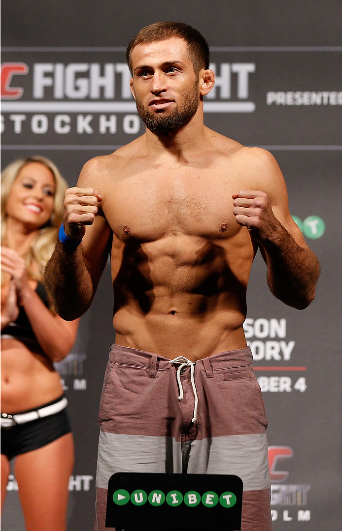 STOCKHOLM, SWEDEN - OCTOBER 03:  Mairbek Taisumov of Russia poses on the scale after weighing in during the UFC weigh-in at the Ericsson Globe Arena on October 3, 2014 in Stockholm, Sweden.  (Photo by Josh Hedges/Zuffa LLC/Zuffa LLC)