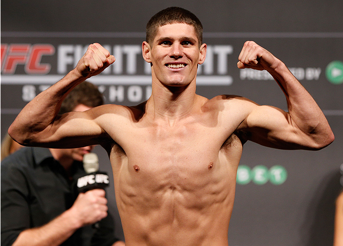 STOCKHOLM, SWEDEN - OCTOBER 03: Charles Rosa poses on the scale after weighing in during the UFC weigh-in at the Ericsson Globe Arena on October 3, 2014 in Stockholm, Sweden. (Photo by Josh Hedges/Zuffa LLC/Zuffa LLC)