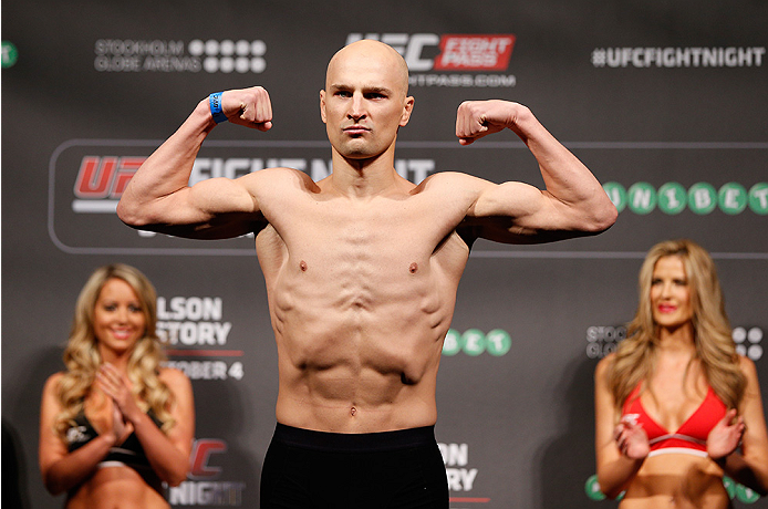 STOCKHOLM, SWEDEN - OCTOBER 03: Alexander Yakovlev of Russia poses on the scale after weighing in during the UFC weigh-in at the Ericsson Globe Arena on October 3, 2014 in Stockholm, Sweden. (Photo by Josh Hedges/Zuffa LLC/Zuffa LLC)