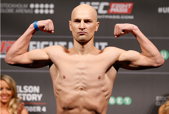 STOCKHOLM, SWEDEN - OCTOBER 03: Alexander Yakovlev of Russia poses on the scale after weighing in during the UFC weigh-in at the Ericsson Globe Arena on October 3, 2014 in Stockholm, Sweden. (Photo by Josh Hedges/Zuffa LLC/Zuffa LLC)