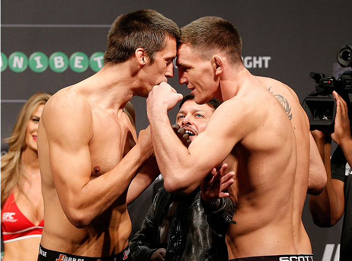 STOCKHOLM, SWEDEN - OCTOBER 03:  (L-R) Opponents Magnus Cedenblad of Sweden and Scott Askham of England face off during the UFC weigh-in at the Ericsson Globe Arena on October 3, 2014 in Stockholm, Sweden.  (Photo by Josh Hedges/Zuffa LLC/Zuffa LLC)