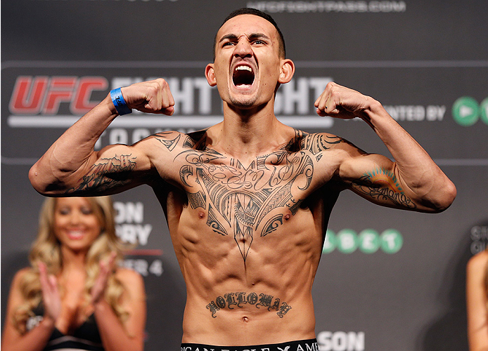 STOCKHOLM, SWEDEN - OCTOBER 03:  Max Holloway poses on the scale after weighing in during the UFC weigh-in at the Ericsson Globe Arena on October 3, 2014 in Stockholm, Sweden.  (Photo by Josh Hedges/Zuffa LLC/Zuffa LLC)