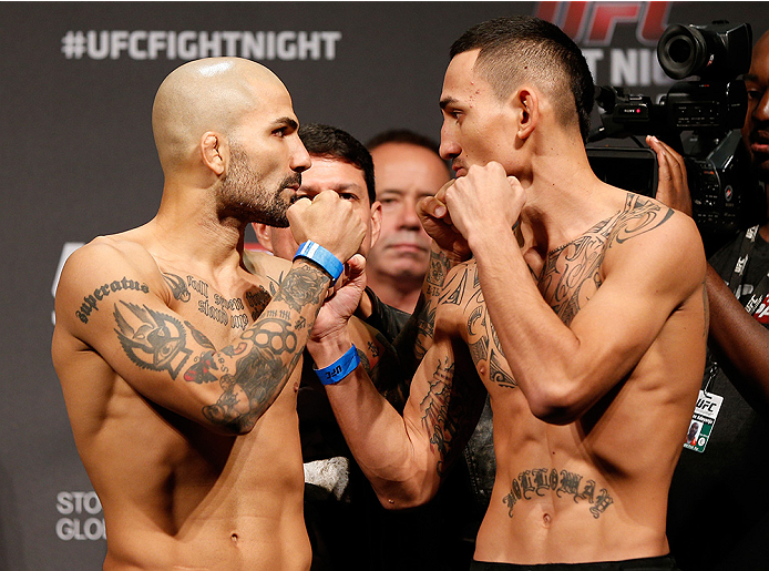 STOCKHOLM, SWEDEN - OCTOBER 03:  (L-R) Opponents Akira Corassani of Sweden and Max Holloway face off during the UFC weigh-in at the Ericsson Globe Arena on October 3, 2014 in Stockholm, Sweden.  (Photo by Josh Hedges/Zuffa LLC/Zuffa LLC)