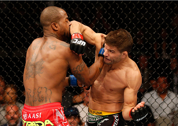 SAN JOSE, CA - JULY 26:  (R-L) Josh Thomson elbows Bobby Green in their lightweight bout during the UFC Fight Night event at SAP Center on July 26, 2014 in San Jose, California.  (Photo by Josh Hedges/Zuffa LLC/Zuffa LLC via Getty Images)