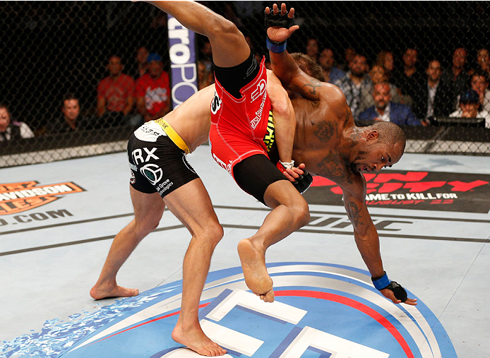 SAN JOSE, CA - JULY 26:  (L-R) Josh Thomson takes down Bobby Green in their lightweight bout during the UFC Fight Night event at SAP Center on July 26, 2014 in San Jose, California.  (Photo by Josh Hedges/Zuffa LLC/Zuffa LLC via Getty Images)