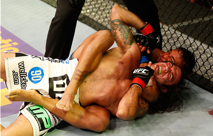 SAN JOSE, CA - JULY 26: (R-L) Dennis Bermudez secures a rear choke submission against Clay Guida in their featherweight bout during the UFC Fight Night event at SAP Center on July 26, 2014 in San Jose, California. (Photo by Josh Hedges/Zuffa LLC/Zuffa L
