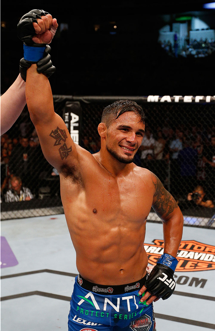 SAN JOSE, CA - JULY 26: Dennis Bermudez celebrates after his submission victory over Clay Guida in their featherweight bout during the UFC Fight Night event at SAP Center on July 26, 2014 in San Jose, California. (Photo by Josh Hedges/Zuffa LLC/Zuffa LL