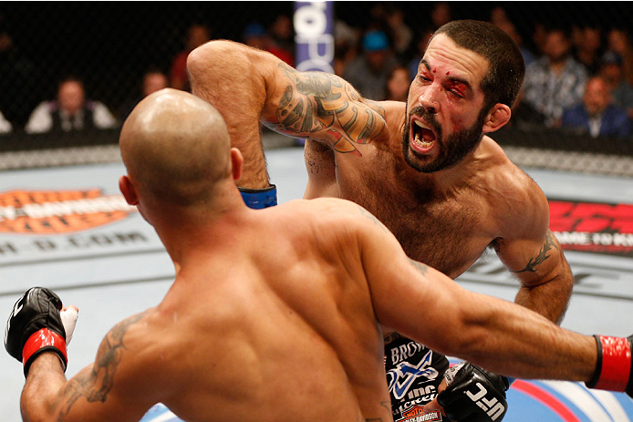 SAN JOSE, CA - JULY 26:  (R-L) Matt Brown punches Robbie Lawler in their welterweight bout during the UFC Fight Night event at SAP Center on July 26, 2014 in San Jose, California.  (Photo by Josh Hedges/Zuffa LLC/Zuffa LLC via Getty Images)