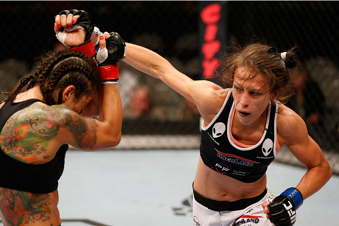 SAN JOSE, CA - JULY 26:  (R-L) Joanna Jedrzejczyk punches Julianna Lima in their womens strawweight bout during the UFC Fight Night event at SAP Center on July 26, 2014 in San Jose, California.  (Photo by Josh Hedges/Zuffa LLC/Zuffa LLC via Getty Images)