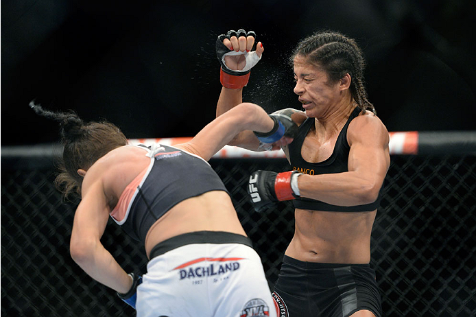 SAN JOSE, CA - JULY 26: (L-R) Joanna Jedrzejczyk punches Julianna Lima in their women's strawweight bout during the UFC Fight Night event at the SAP Center on July 26, 2014 in San Jose, California. (Photo by Jeff Bottari/Zuffa LLC/Zuffa LLC via Getty Imag