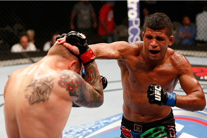 SAN JOSE, CA - JULY 26:  (R-L) Gilbert Burns punches Andreas Stahl in their welterweight bout during the UFC Fight Night event at SAP Center on July 26, 2014 in San Jose, California.  (Photo by Josh Hedges/Zuffa LLC/Zuffa LLC via Getty Images)