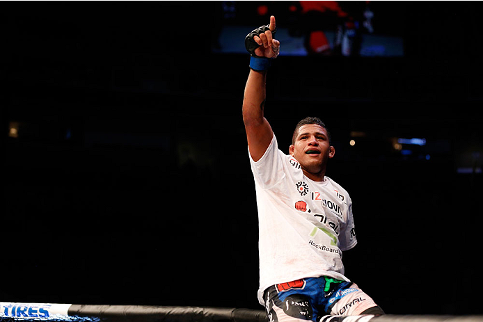 SAN JOSE, CA - JULY 26:  Gilbert Burns celebrates after defeating Andreas Stahl in their welterweight bout during the UFC Fight Night event at SAP Center on July 26, 2014 in San Jose, California.  (Photo by Josh Hedges/Zuffa LLC/Zuffa LLC via Getty Images