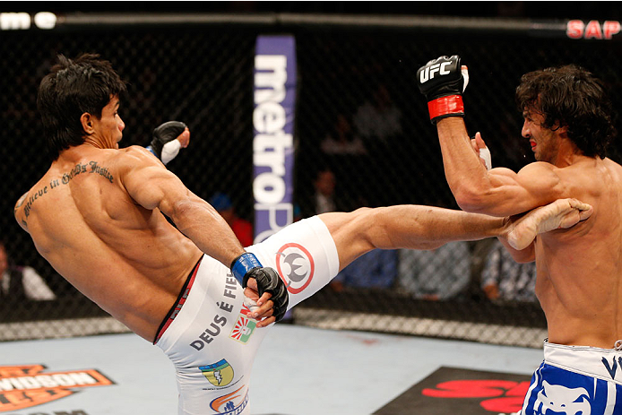 SAN JOSE, CA - JULY 26:  (L-R) Tiago Trator kicks Akbarh Arreola in their lightweight bout during the UFC Fight Night event at SAP Center on July 26, 2014 in San Jose, California.  (Photo by Josh Hedges/Zuffa LLC/Zuffa LLC via Getty Images)