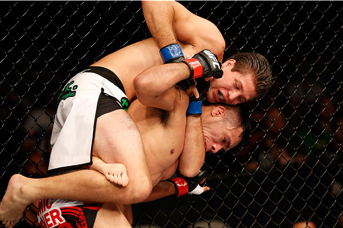 SAN JOSE, CA - JULY 26: (L-R) Brian Ortega attempts to secure a rear choke submission against Mike De La Torre in their featherweight bout during the UFC Fight Night event at SAP Center on July 26, 2014 in San Jose, California. (Photo by Josh Hedges/Zuf