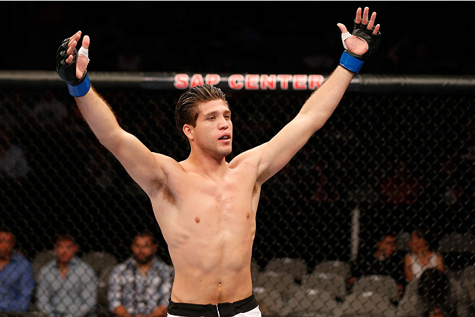 SAN JOSE, CA - JULY 26:  Brian Ortega celebrates after his submission victory over Mike De La Torre in their featherweight bout during the UFC Fight Night event at SAP Center on July 26, 2014 in San Jose, California.  (Photo by Josh Hedges/Zuffa LLC/Zuffa