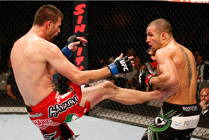 SAN JOSE, CA - JULY 26:  (L-R) Tim Means kicks Hernani Perpetuo in their welterweight bout during the UFC Fight Night event at SAP Center on July 26, 2014 in San Jose, California.  (Photo by Josh Hedges/Zuffa LLC/Zuffa LLC via Getty Images)