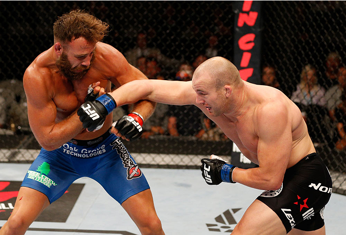 SAN JOSE, CA - JULY 26:  (R-L) Patrick Cummins punches Kyle Kingsbury in their light heavyweight bout during the UFC Fight Night event at SAP Center on July 26, 2014 in San Jose, California.  (Photo by Josh Hedges/Zuffa LLC/Zuffa LLC via Getty Images)