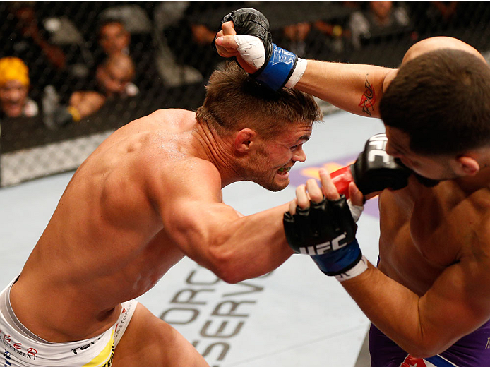 SAN JOSE, CA - JULY 26:  (L-R) Daron Cruickshank punches Jorge Masvidal in their lightweight bout during the UFC Fight Night event at SAP Center on July 26, 2014 in San Jose, California.  (Photo by Josh Hedges/Zuffa LLC/Zuffa LLC via Getty Images)