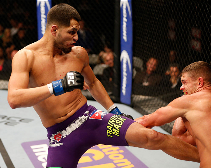 SAN JOSE, CA - JULY 26: (L-R) Jorge Masvidal kicks Daron Cruickshank in their lightweight bout during the UFC Fight Night event at SAP Center on July 26, 2014 in San Jose, California. (Photo by Josh Hedges/Zuffa LLC/Zuffa LLC via Getty Images)